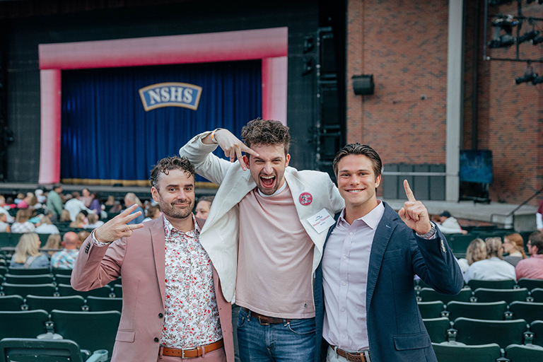 Three guys standing together.