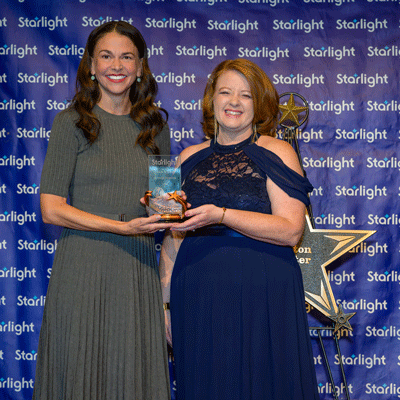 Starlight CEO Lindsey Rood-Clifford poses with Sutton Foster.