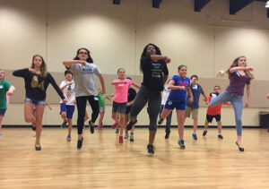 Students rehearsing with an instructor