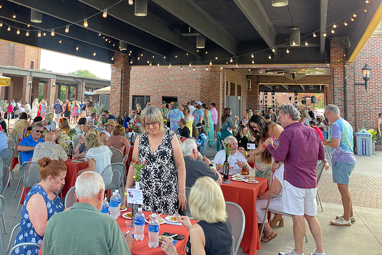 People eating and drinking at a group event