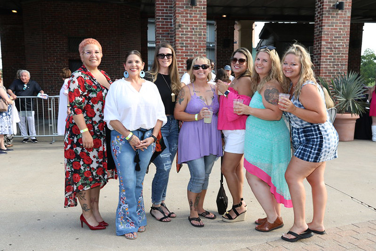 Group of women posing at a theme night event