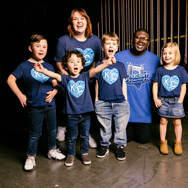 Kids and adults wearing Charlie Hustle Starlight shirts