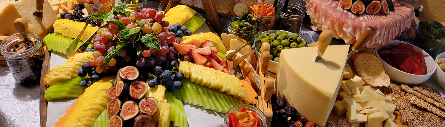 Display of cheese and fruit on a table