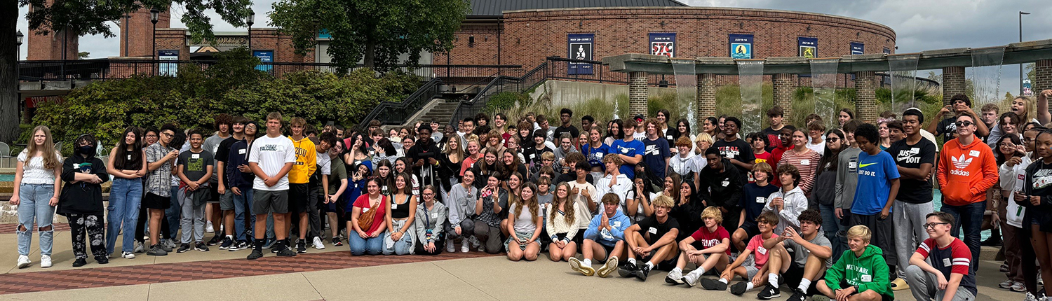 Students from North Kansas City Schools pose in front of the Starlight fountain