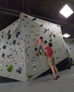 Ryan and kiddo rock climbing