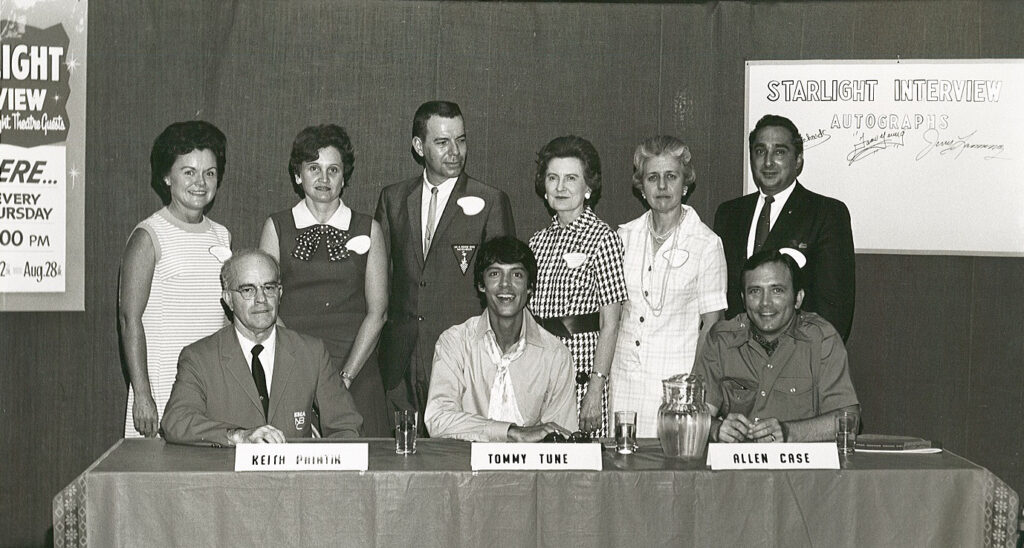 Performer Tommy Tune with group of people