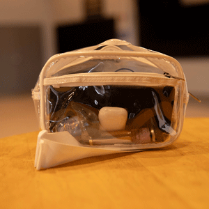 Clear plastic bag with a white strap.
