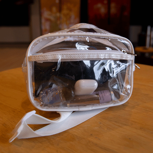 Clear bag with a white strap.
