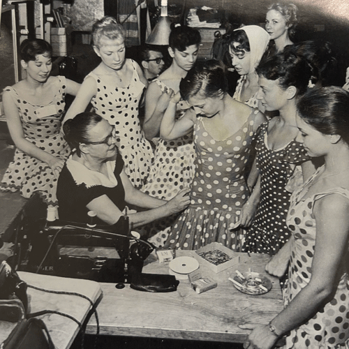 Virginia Donovan in the costume shop fitting members of the Starlight chorus